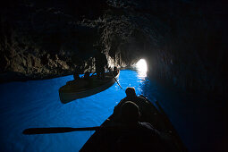 Rowing boats inside the Blue Grotto, Capri, Campania, Italy