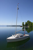 Boat on Lake Starnberg on a day in summer, Tutzing, Bavaria, Germany