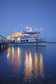 Illuminated museum ship at lakeshore, Lake Starnberg, Kustermannpark, Tutzing, Bavaria, Germany