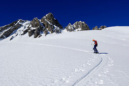Female backcountry skier ascending, Allgaeu Alps, Tyrol, Austria