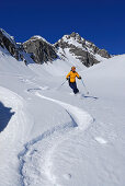 young woman powdering in Noppenkar, Allgaeu range, Allgaeu, Tyrol, Austria