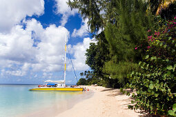 People entering a catamaran, Mullins Bay, Speightstown, Barbados, Caribbean