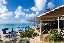 People relaxing at beach, Mullins Bay, Speightstown, Barbados, Caribbean