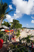 People relaxing at beach near the Boatyard beach bar, Bridgetown, Barbados, Caribbean