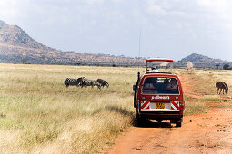 Safari bus on the way in Tsavo East National Park, Coast, Kenya
