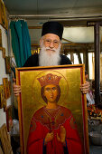 Icon painter Father Kallinikos holding a painting, icon, Stravrovouni monastery, Larnaka, South Cyprus, Cyprus