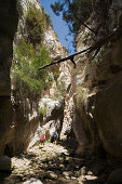 Two people hiking through Avakas Gorge, Akamas Nature Reserve Park, South Cyprus, Cyprus