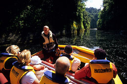 People sitting in a motorboat, Wanganui River, North Island, New Zealand