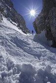 Female backcountry skier ascenting, Griesner Kar, Wilder Kaiser, Kaiser range, Tyrol, Austria