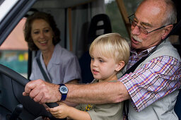 Grandparents with grandson in a motorhome