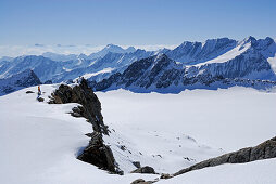 Female back-country skier ascending Lusener Spizte, Stubai Alps in background, Sellrain, Tyrol, Austria