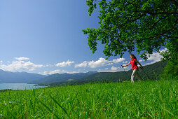 Woman nordic walking, lake Tegernsee, Bavarian foothills, Upper Bavaria, Bavaria, Germany