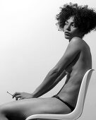 rs, 30-40 years, Absorbed, Adult, Adults, Afro, Afro hairstyle, BundW, Black-and-White, Brunette, Brunettes, Chair, Chairs, Cigarette, Cigarettes, Contemporary, Curly hair, Dark-haired, Ethnic, Ethnicit