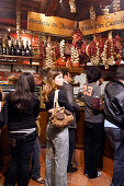 People in a delicatessen store at Campo de Fiori, Rome, Italy