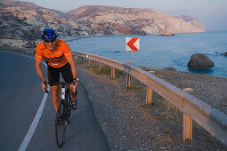 Man bicycling at Petra tou Romiou, Aphrodites birthplace, Petra tou Romiou, Cyprus