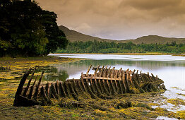 Wreck at a lake at the Ring of Beara, County Kerry, Ireland, Europe