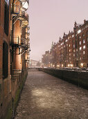 Ice floes on dike, Speicherstadt (storehouse-town), Hamburg, Germany