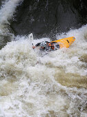 Kayak in the white water of the Regnitz River, Franconia, Bavaria, Germany