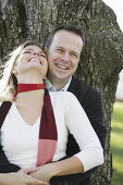 Mid adult couple near a tree