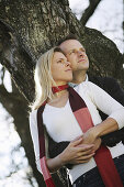 Mid adult couple near a tree