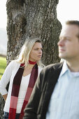 Mid adult couple near a tree