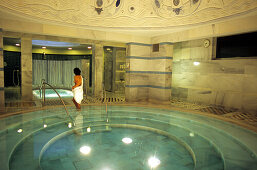 Woman in the Mineral spa pool of the Roman Irish Bath in Scuol, Lower Engadine, Engadine, Switzerland