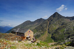 hikers in front of hut Nuernberger Huette, Stubaier Alpen range, Stubai, Tyrol, Austria