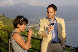 Woman smelling wine, winetasting, Lavaux, Canton of Vaud, Switzerland