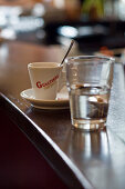 Espresso cup and glass of water in a cafe, Ingolstadt, Bavaria, Germany