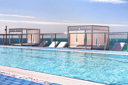 Rooftop pool of the Gaansevoort South Hotel in the sunlight, South Beach, Miami Beach, Florida, USA