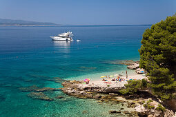 People at the beach in a little bay, Brac Island, Dalmatia, Croatia, Europe