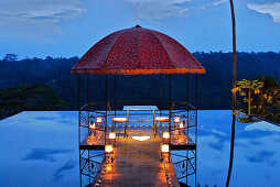 Water basin with pavilion on the roof of a restaurant in the evening, Kupu Kupu Barong Resort, Ubud, Indonesia, Asia