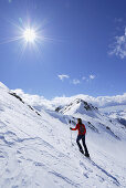 Backcountry skier ascending, Kassianspitze, Sarntal Alps, Trentino-Alto Adige/Südtirol, Italy