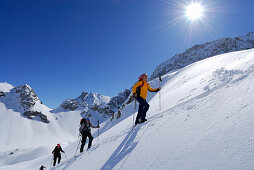 Backcountry skiers ascending , Tajatoerl, Mieminger range, Ehrwald, Tyrol, Austria