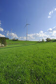 Two wind turbines in meadow, Bavaria, Germany