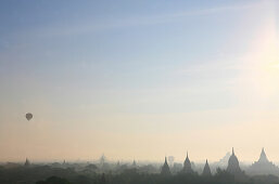 Hot air balloon iover the temple towers at the plain of Bagan, Myanmar, Burma, Asia
