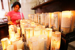 Believer lightening a candle, Kathedrale Metropolitana da Sé, Sao Paulo, Brazil