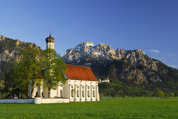St. Coloman church with Neuschwanstein Castle, near Schwangau, Allgaeu, Bavaria, Germany