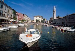 Motor boats at harbour under blue sky, Lazise, Lake Garda, Veneto, Italy, Europe