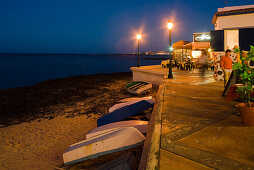 Boats and restaurant on the beach at dusk, Corralejo, Fuerteventura, Canary Islands, Spain, Europe