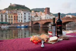 Picnic at the river Fiume Temo with view to the Castello di Serravalle, Bosa, Sardinia, Italy, Europe