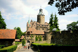 Tourists in front of Tschochau castle in the sunlight, Bohemian mountains, lower-Silesia, Poland, Europe