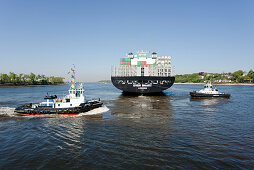 Container ship and tugboats, Port of Hamburg, Germany