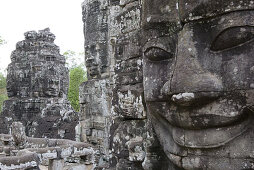Stone faces of Bodhisattva Lokeshvara in the Bayon temple at Angkor, Siem Reap Province, Cambodia, Asia