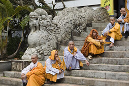 Buddhistic monks on the stairs of the Linh Son Pagoda at Dalat, Lam Dong Province, Vietnam, Asia