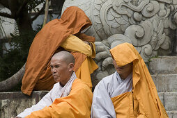 Buddhistic monks on the stairs of the Linh Son Pagoda at Dalat, Lam Dong Province, Vietnam, Asia