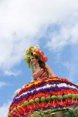 Woman on Floral Float at Flower Festival Parade, Funchal, Madeira, Portugal