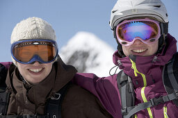 Portrait of two female skiers in front of a mountain, Kappl, Tyrol, Austria