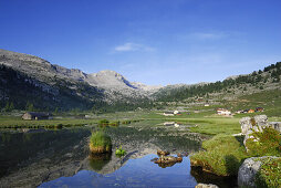 Reflection of mountains on lake Gruensee, Fanesalm, Naturpark Fanes-Sennes-Prags, Dolomites, Trentino-Alto Adige/South Tyrol, Italy