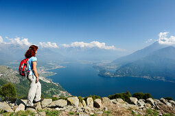 Woman looking over Lake Como, Monti Lariani, Lombardy, Italy